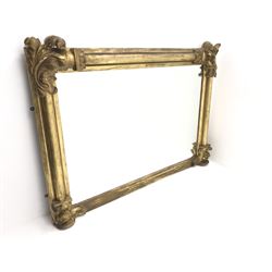 Large 19th century gilt wood and gesso overmantel mirror, plain column pilasters, the corners with scrolled leaf mounts 