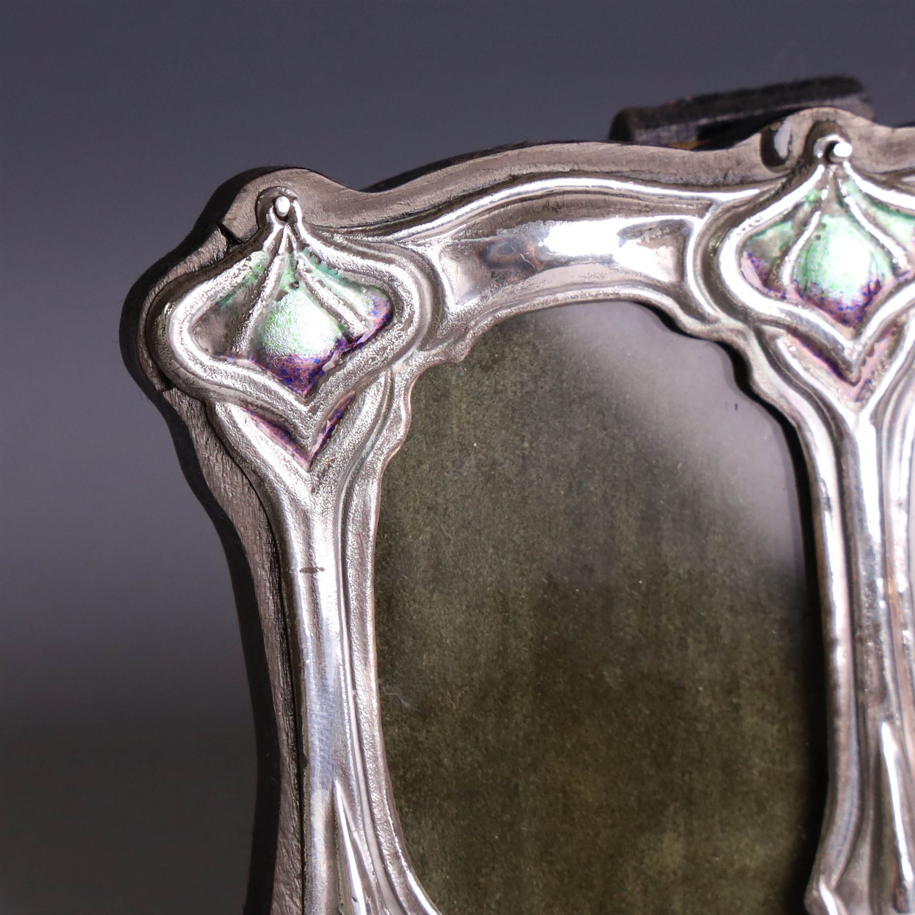 Silver mounted Art Nouveau style double photograph frame, with enamel decoration and wooden easel stand verso, stamped Sterling H8cm, W11cm,