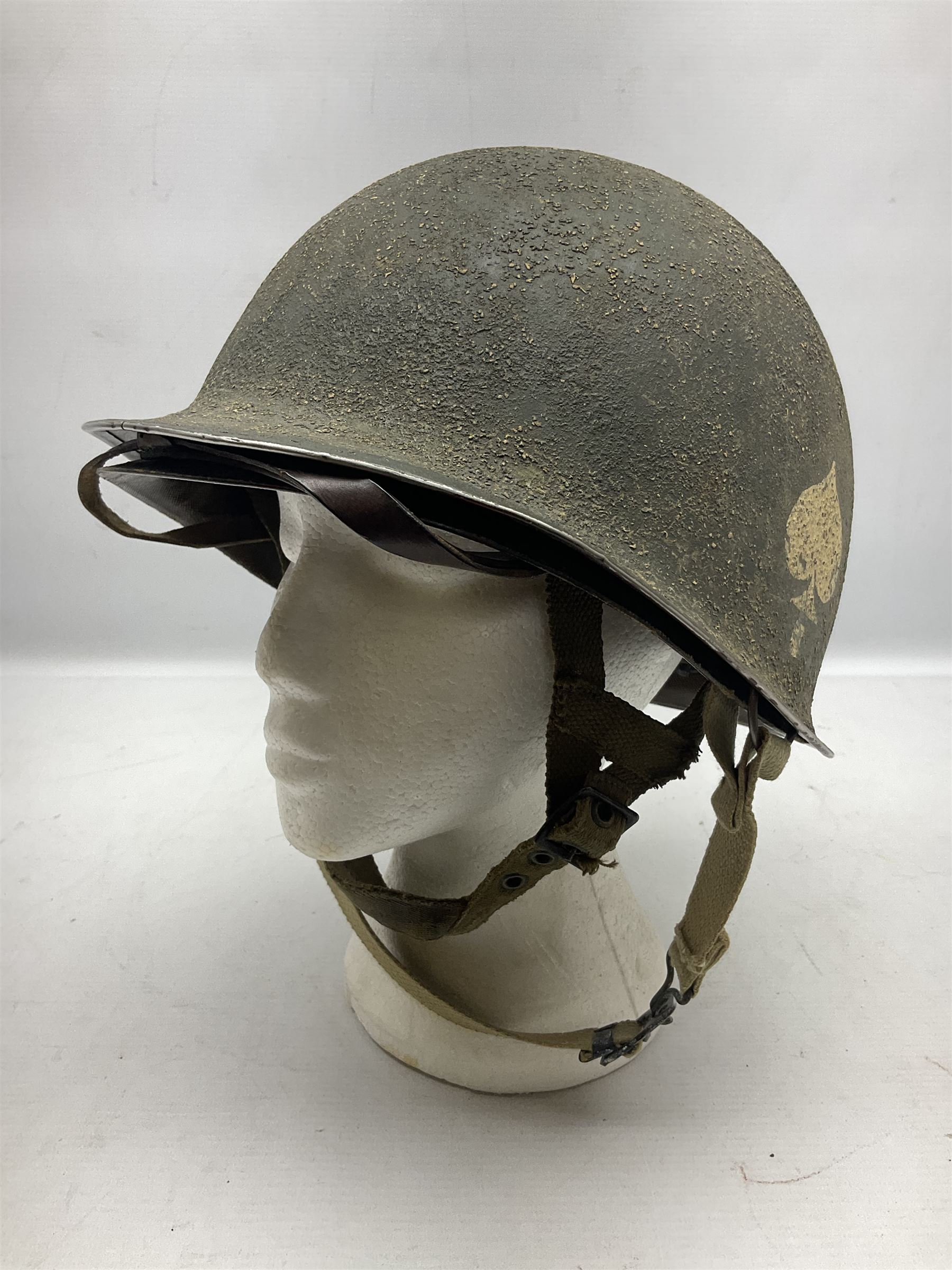 American first type paratrooper helmet with post-WW2 strap and D-rings and later 1944 liner bearing Firestone Tyre and Rubber Company mark; green textured finish
