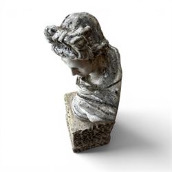 Roman Neoclassical style cast stone bust, weathered finish, raised on textured stone plinth of tapering form