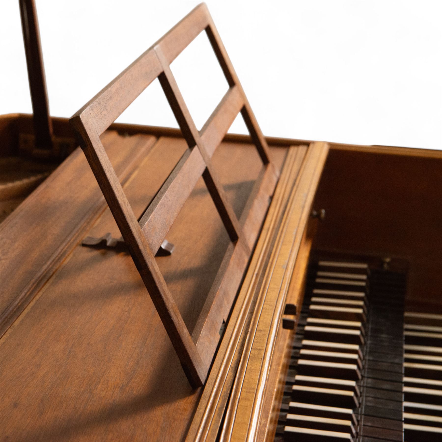 20th century “French style” Two manual Harpsichord by John Rooks of Tincknall (1971).
Double manual keyboards with three sets of strings: Two Unison, one octave and “buff” stop. Black outer casing with gold banding, five octave keyboards with 63 keys E1-G6, with black naturals and synthetic covered white sharps, inner lid painted with a rural scene, with adjustable music desk. Soundboard, bridges, strings and synthetic jacks in good condition with just one small crack to the treble area of the soundboard, key action with reasonable repetition and damping but in need of some regulation, case raised on turned baluster supports.

 You can find and listen to an example of Alan Cuckston playing this particular Harpsichord in the link below:
The King’s Hunt by John Bull

Given the intricate nature of these historic instruments, specialist support will be available if required, to assist successful buyers with safe removal and onward handling. Price upon application. 

