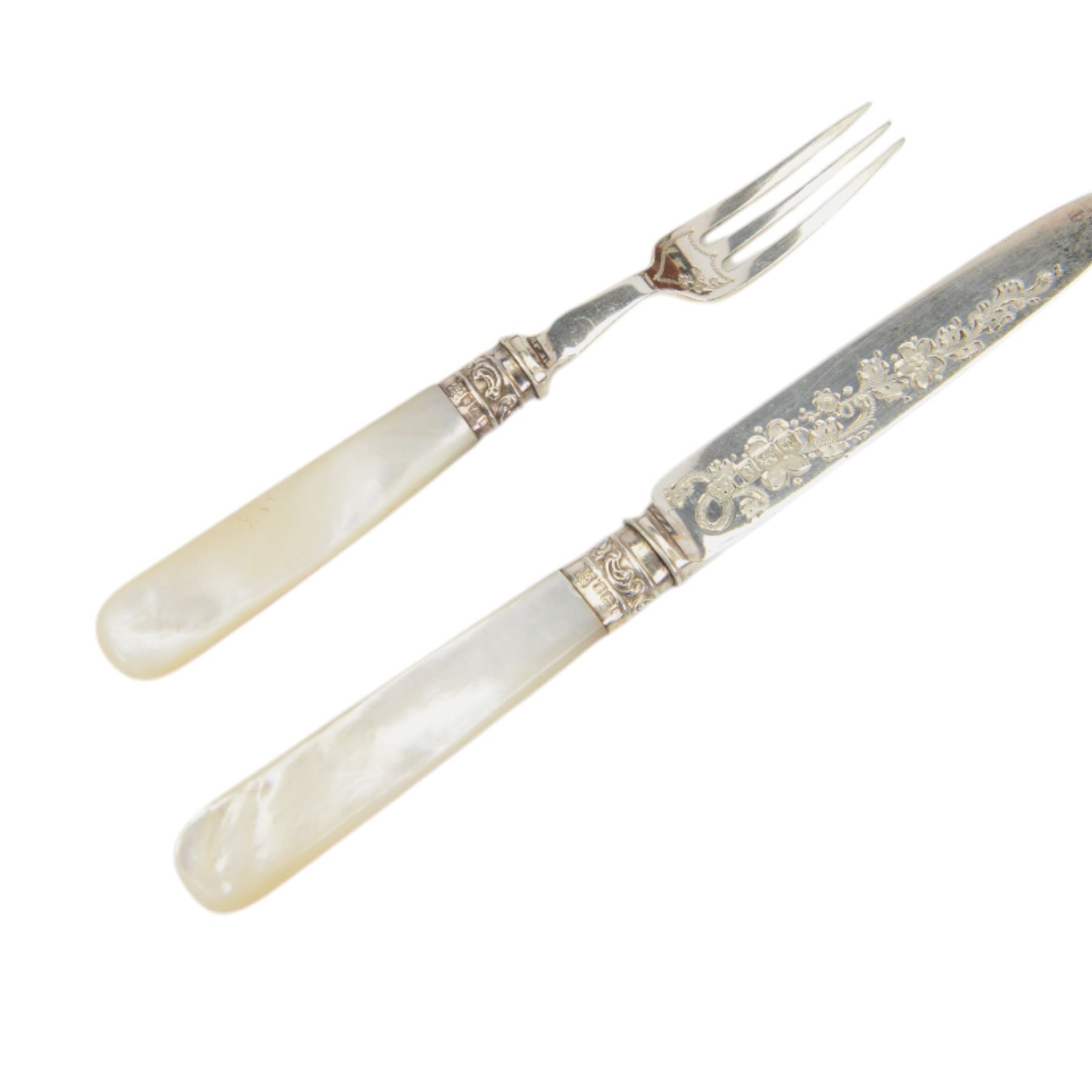 Set of twelve mother of pearl handled silver fruit knives and forks, the knives with floral engraving to blades, hallmarked to both collars and blades/prongs, Frederick C Asman & Co, Sheffield 1906, contained within fitted wooden case with velvet lined interior