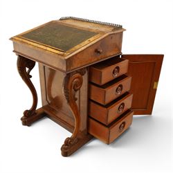 Victorian figured walnut Davenport, the fixed fall with drawer to the side enclosing writing compartment, green tooled leather writing inset, galleried back rail, right side fitted with four drawers behind a panel, opposing panelled side, raised on carved cabriole front supports with scroll terminals and platform base