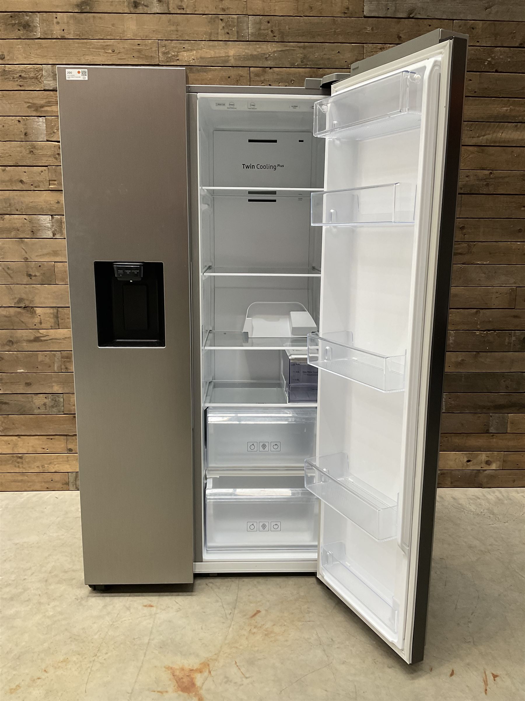 Samsung RS68N8320S9 American style side by side fridge freezer, non plumbed ice and water dispenser. Serial no. 05NT4EBN800405K, August 2020.