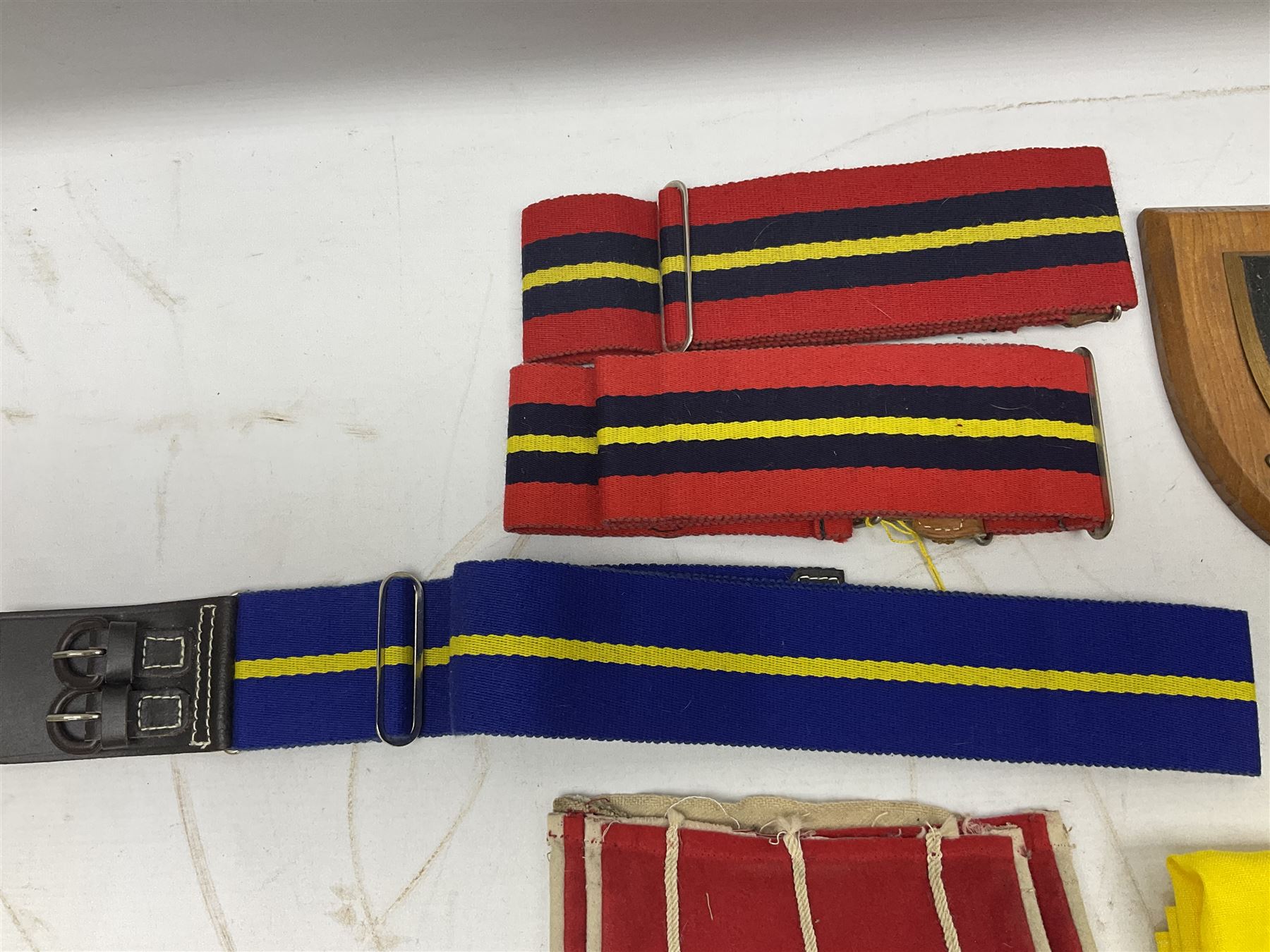 Miscellaneous militaria including two Royal Artillery and one Royal Horse Artillery stable belts; Northamptonshire Regiment trench art brass shell case lighter; unused Matchless Fire-Set; pocket knives and multi-tool; lanyards; oak shield with York & Lancaster crest etc