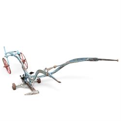 J. & F. Howard Ltd., Bedford - late 19th/early 20th century blue-painted cast iron horse-drawn potato ridger, with twin handles above a curved beam, adjustable ridging body and ploughshare, on red-painted five-spoke wheels, signed HOWARD BEDFORD