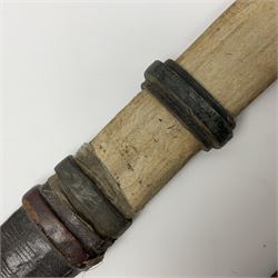 African Mandingo sword, the 75cm triple fullered blade with leather covered grip and brass pommel, in part leather covered scabbard with leaf shaped point L98cm overall