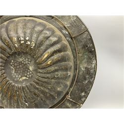 Arts and Crafts brass charger, the dished centre with fluted decoration in relief, surrounded by a continuous band of fish against a hammered ground to the rim, D59cm