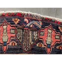 Persian Hamadan blue ground rug, medallion on field decorated with repeating motifs, the guarded border with multiple medallions decorated with flower heads and stylised motifs