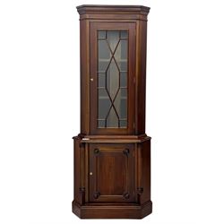 Late 20th century mahogany corner cabinet, dentil moulded cornice above a glazed door with astragal glazing enclosing two shelves, lower cupboard with fielded panel door and turned shell motif, on plinth base