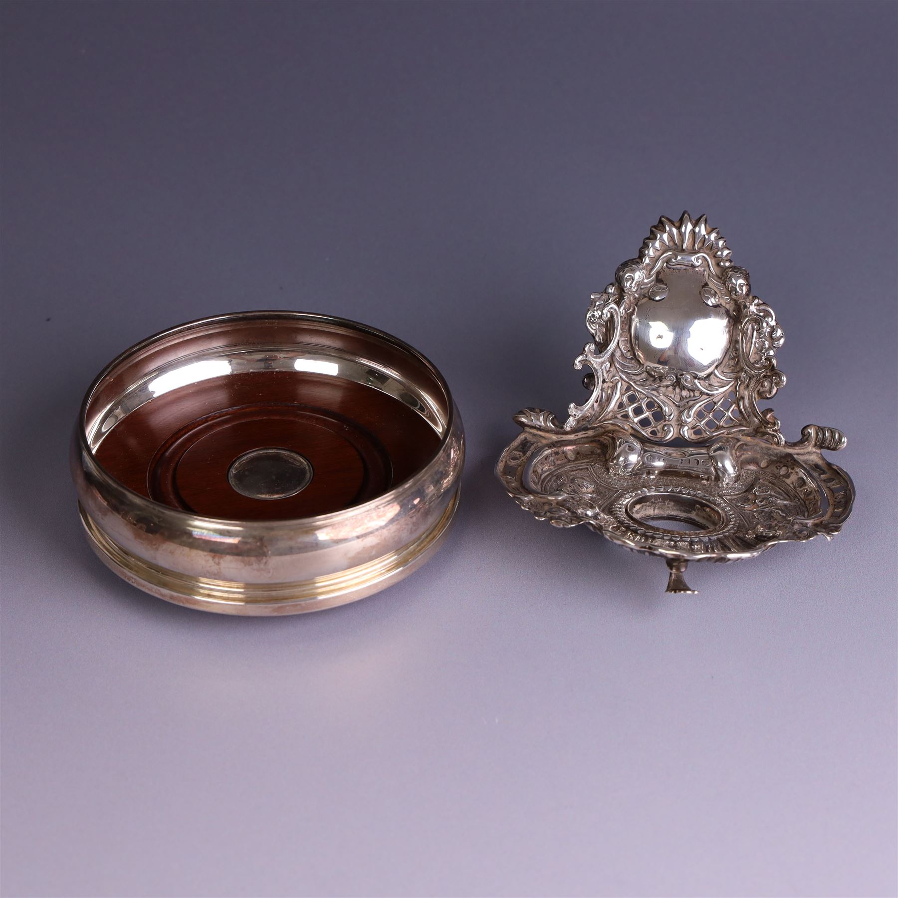 Modern silver mounted bottle coaster, with turned wooden base, hallmarked Carrs of Sheffield Ltd, Sheffield 2003 and a Victorian silver inkwell stand, hallmarks worn and indistinct, coaster D10cm