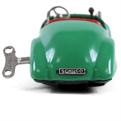 Schuco Examico 4001 tinplate clockwork car, in green with red interior, with key