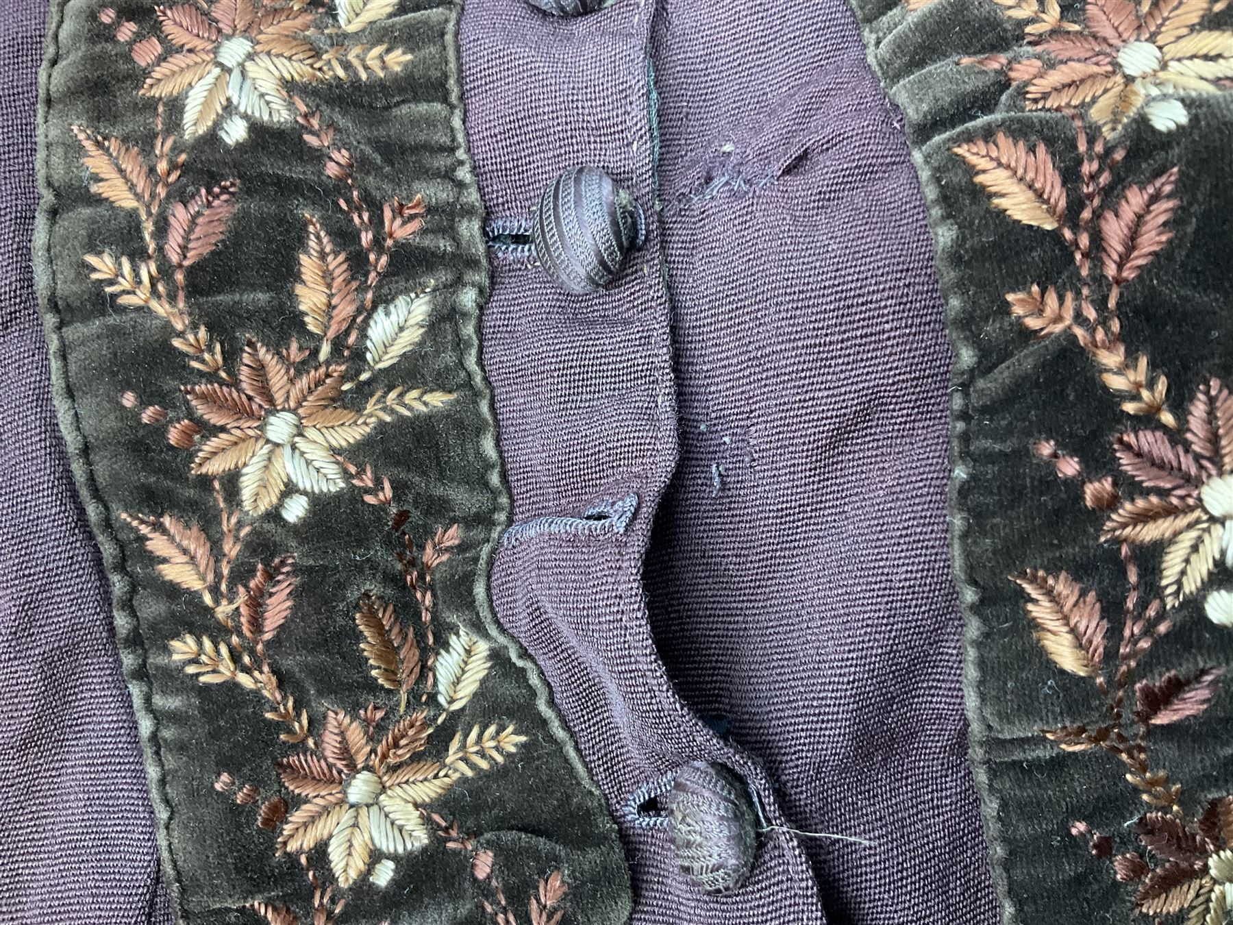 Victorian ladies riding habit, the two-piece construction in brown with embroidered floral velvet edging