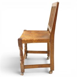 Mouseman - 1940s oak side chair, the slat-back over a slung leather seat, raised on octagonal front supports united by box stretcher, carved with slim mouse signature, by the workshop of Robert Thompson of Kilburn