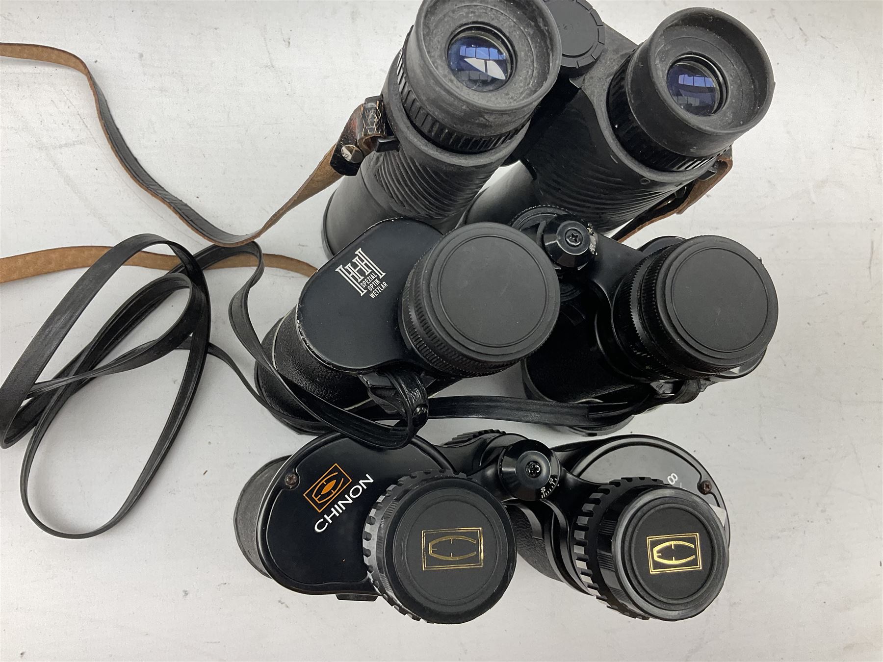 Eleven cased pairs of binoculars to include Summit 8x30,  Concord 8x40, Tasco no. 106 8x - 16x40, Chinon 10x50, Tokina 7x42 Field, Zoom 6x- 12x32 etc