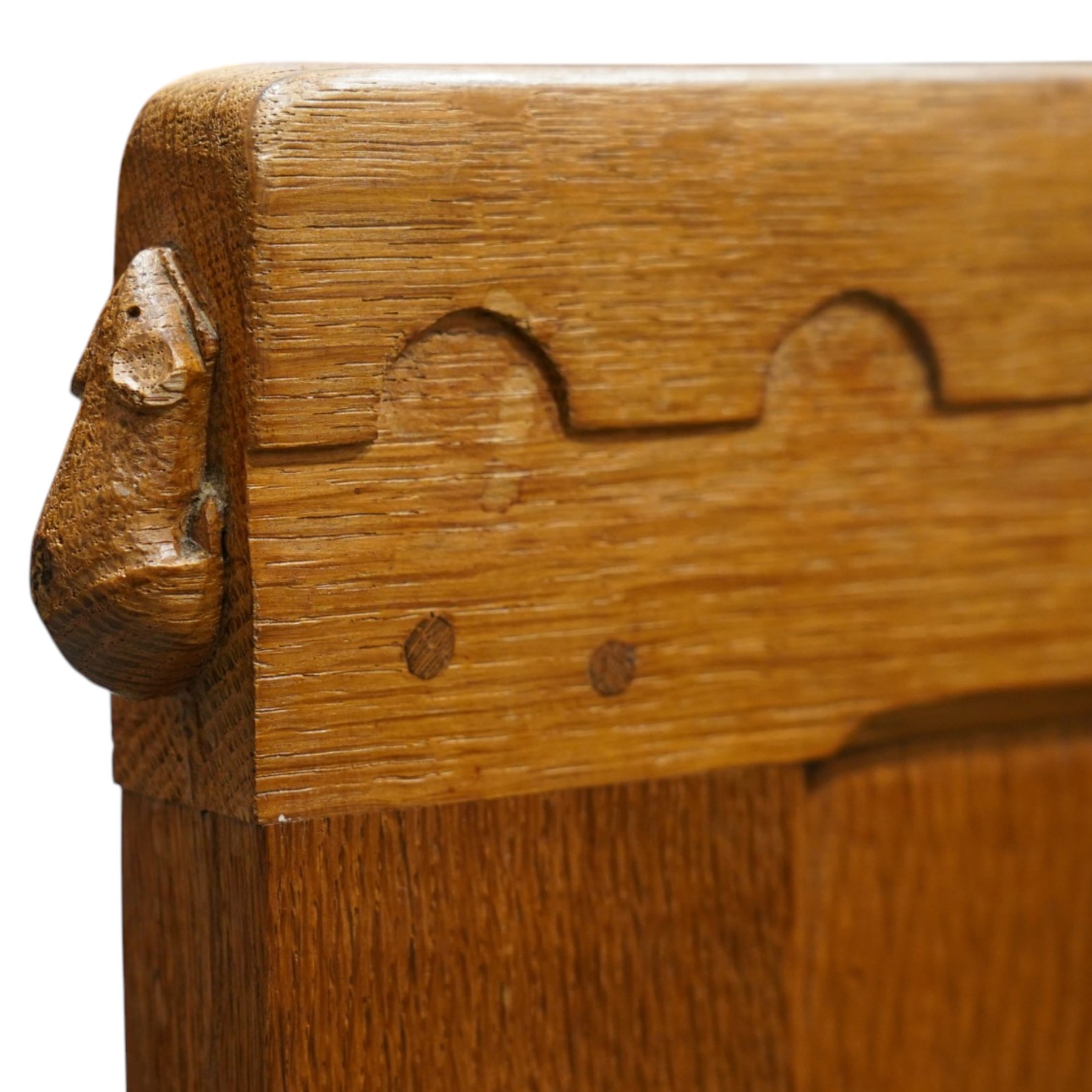 Mouseman - 4'6 panelled oak double bedstead, the head and footboard panelled with arcade carved cresting rails, with bed base and Vono metal rails, with carved mouse signature, by the workshop of Robert Thompson of Kilburn