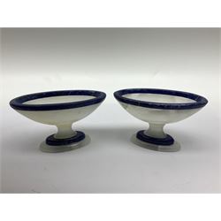 Pair of lapis lazuli and agate open salts, of navette form, upon a stepped oval pedestal foot, H5cm, L8cm