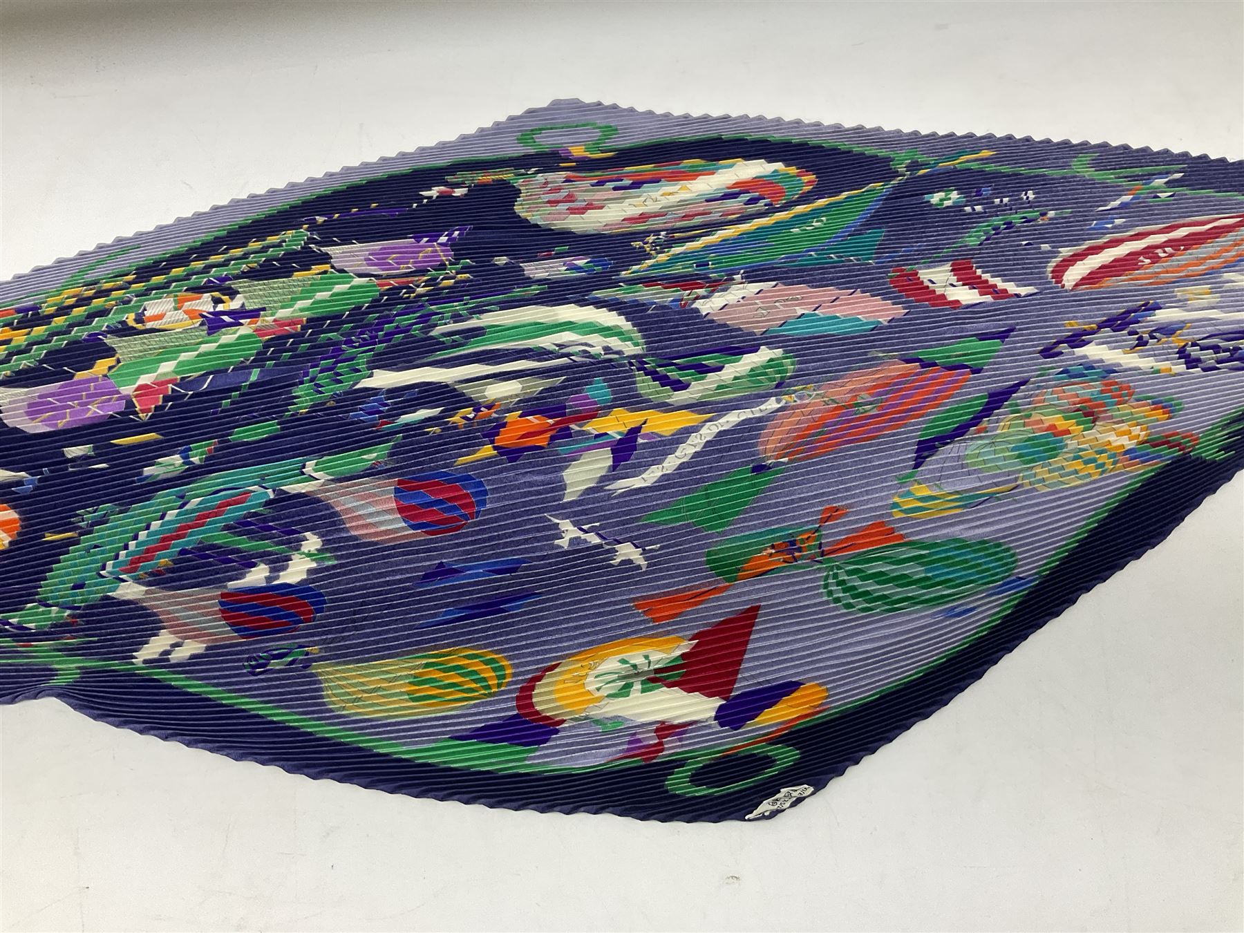 Hermès 'Les Folies Du Ciel' plisse silk scarf, designed by Loïc Dubigeon, printed with hot air balloon motifs, contained within twisted green rope border, on merging light and navy blue ground, with rolled hand stitched edges and Hermes material label, length 129cm