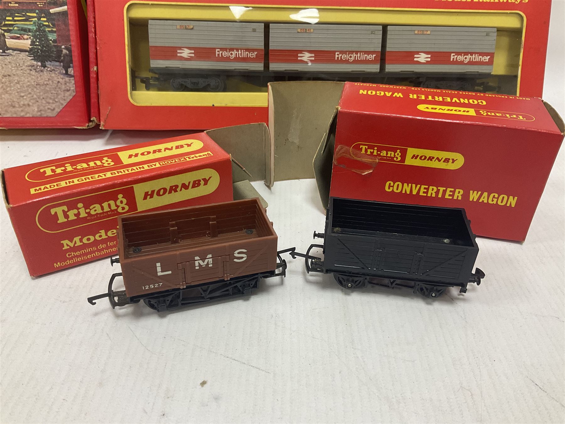 Hornby/Tri-Ang ‘00’ gauge - fifteen goods wagons to include freightliners with containers, ore wagons, closed vans etc; together with R404 Operating ore wagon set; all boxed (16) 