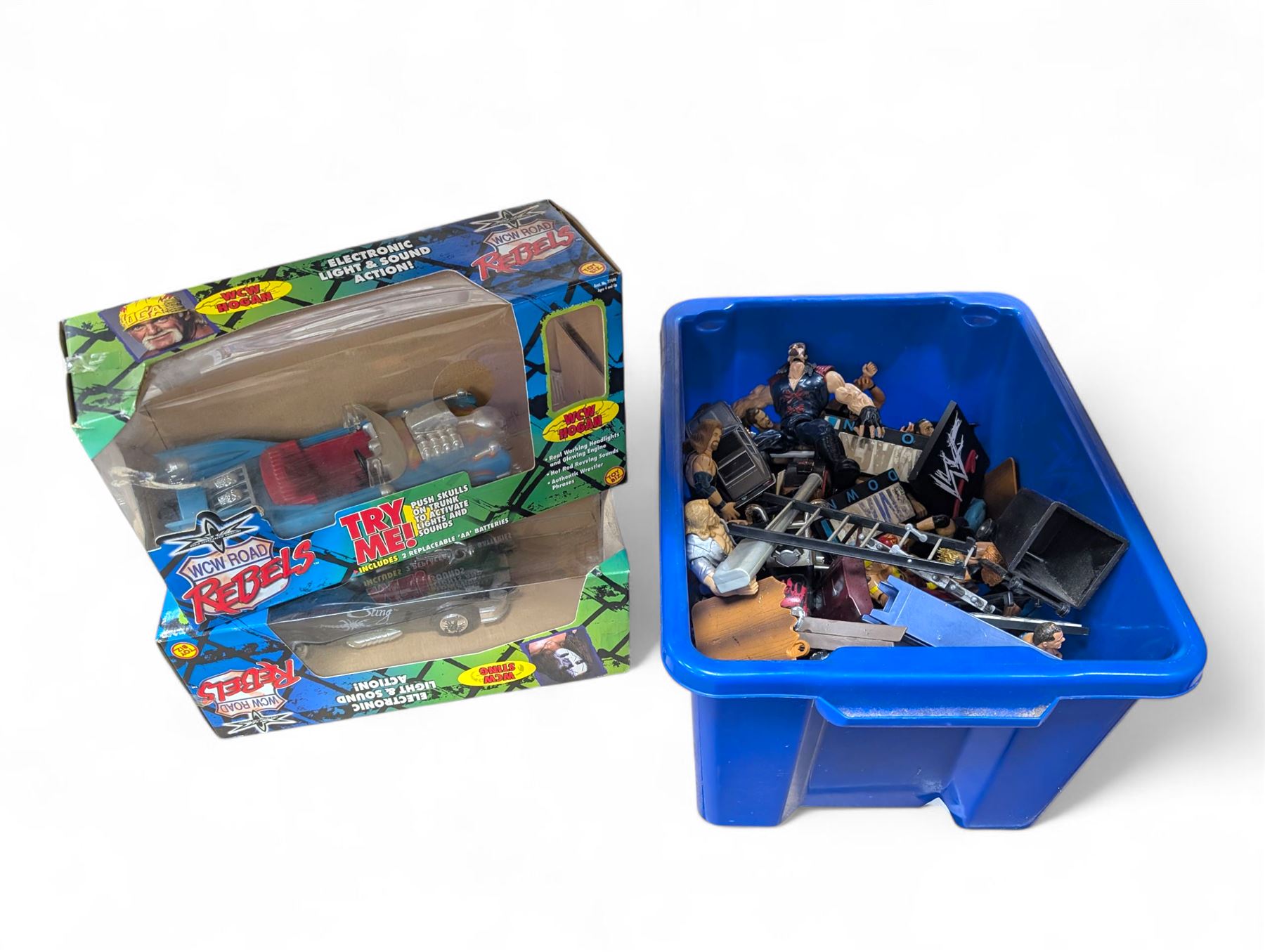Collection of wrestler figures, two WCW Road Rebels vehicles and a collection of accessories