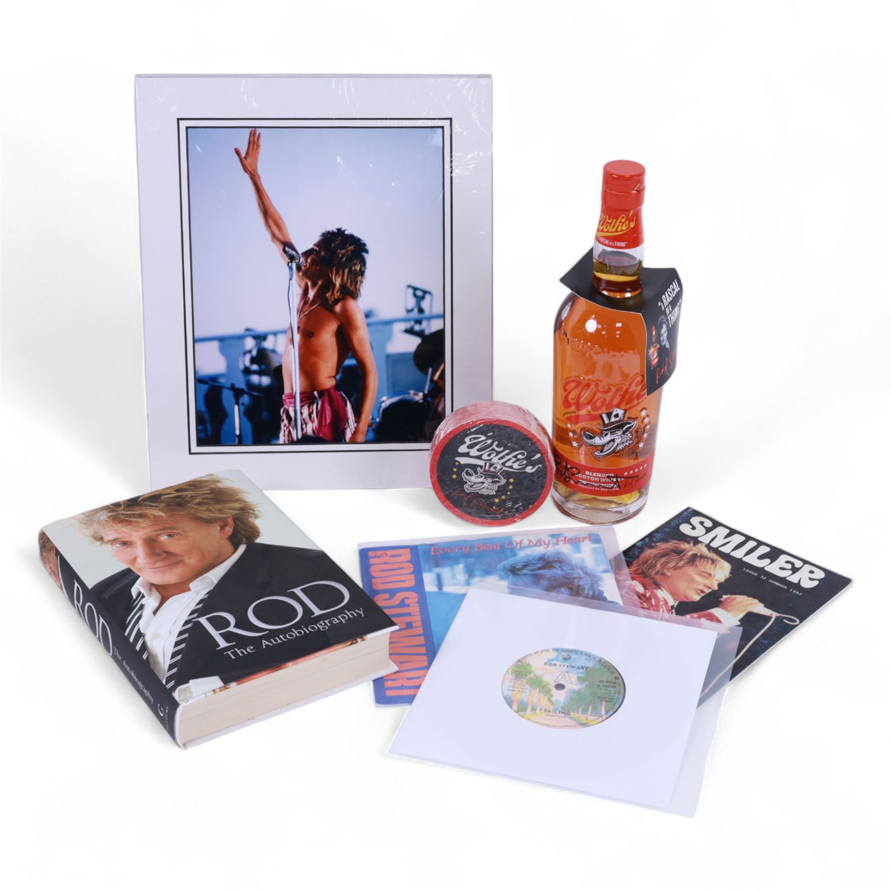 Signed bottle of Rod Stewart edition Wolfie's blended scotch whisky, together with Rod Stewart memorabilia, including first edition of his autobiography, colour photograph and two 7 inch singles
