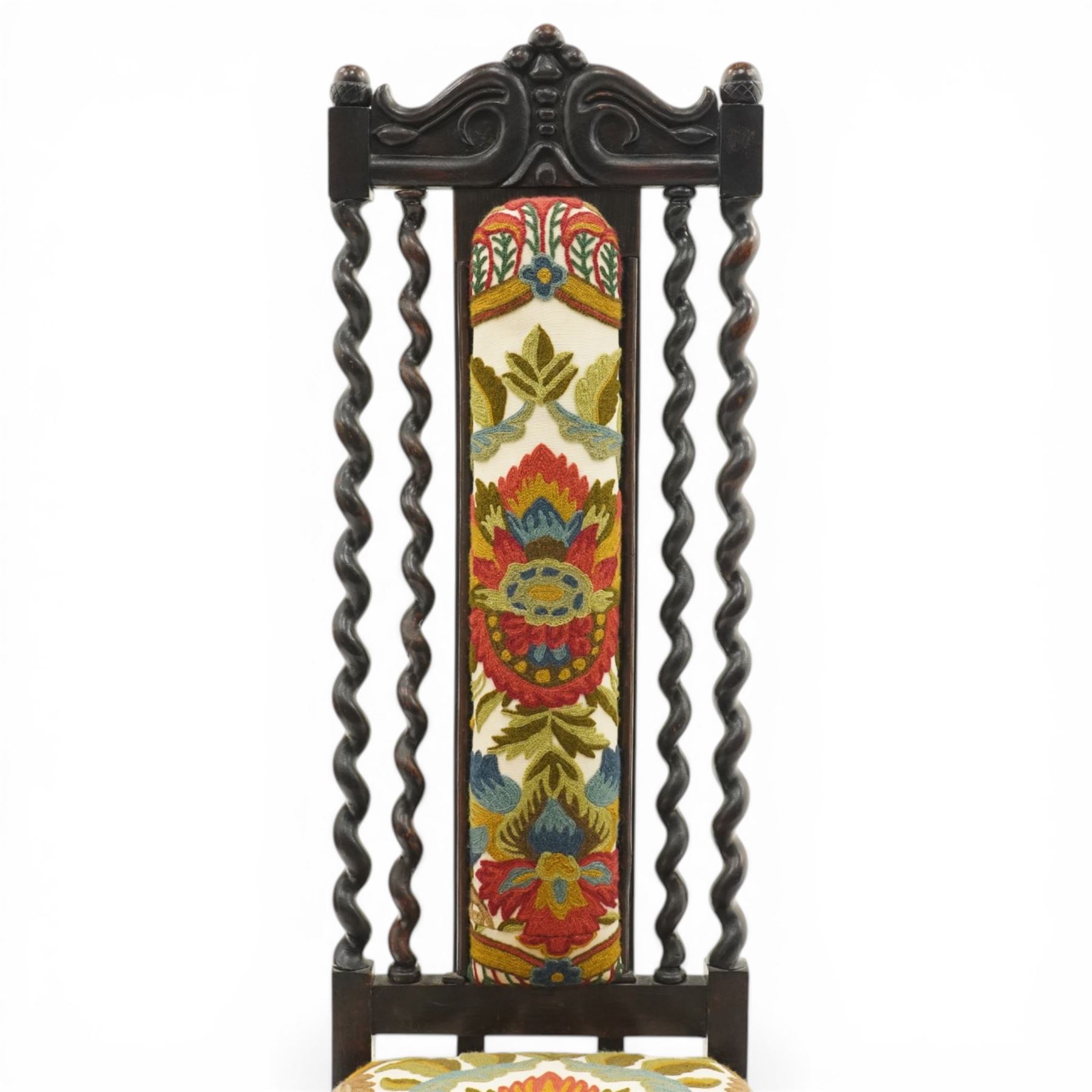 19th century Carolean design oak hall chair, carved cresting rail over barley-twist uprights, high back and loose seat upholstered in wool-work foliate tapestry (W46cm H116cm); 19th century elbow chair mahogany with spiral turned centre rail and roundel-applied frieze (W56cm H85cm)