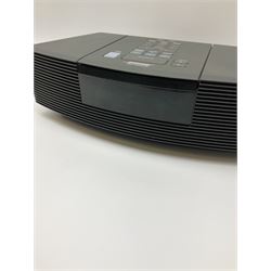 A Bose Wave radio and CD player, model no AWRC3G, with remote and instruction booklets 
