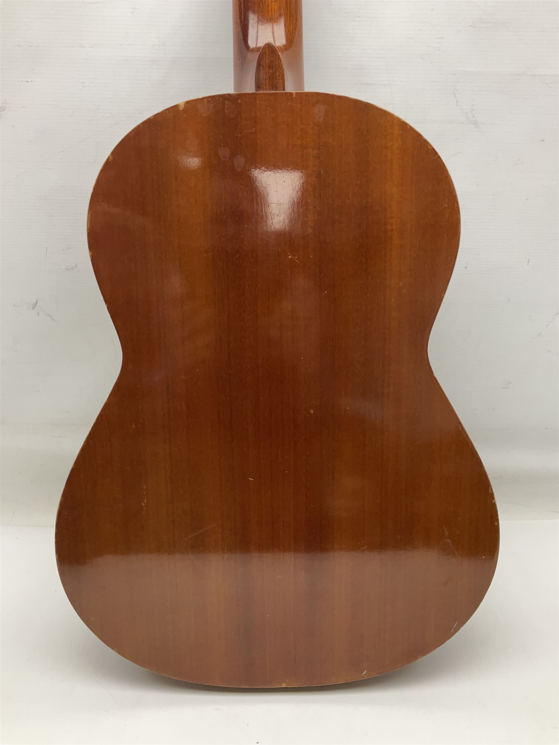 Spanish BM acoustic guitar with mahogany back and sides and spruce top L101cm; in cello carrying case; Roland foot pedal and two Yamaha foot pedals; tin D# organ pipe; folding music stand etc