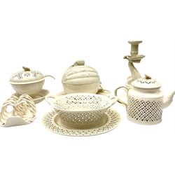 20th century Leeds creamware, comprising chestnut basket and stand, small tureen and cover, ladle, and associated stand, candlestick with stem modelled as a dolphin, teapot, tureen and cover in the form of a melon with fixed stand, and toast rack (toast rack a/f), each with impressed mark beneath. 