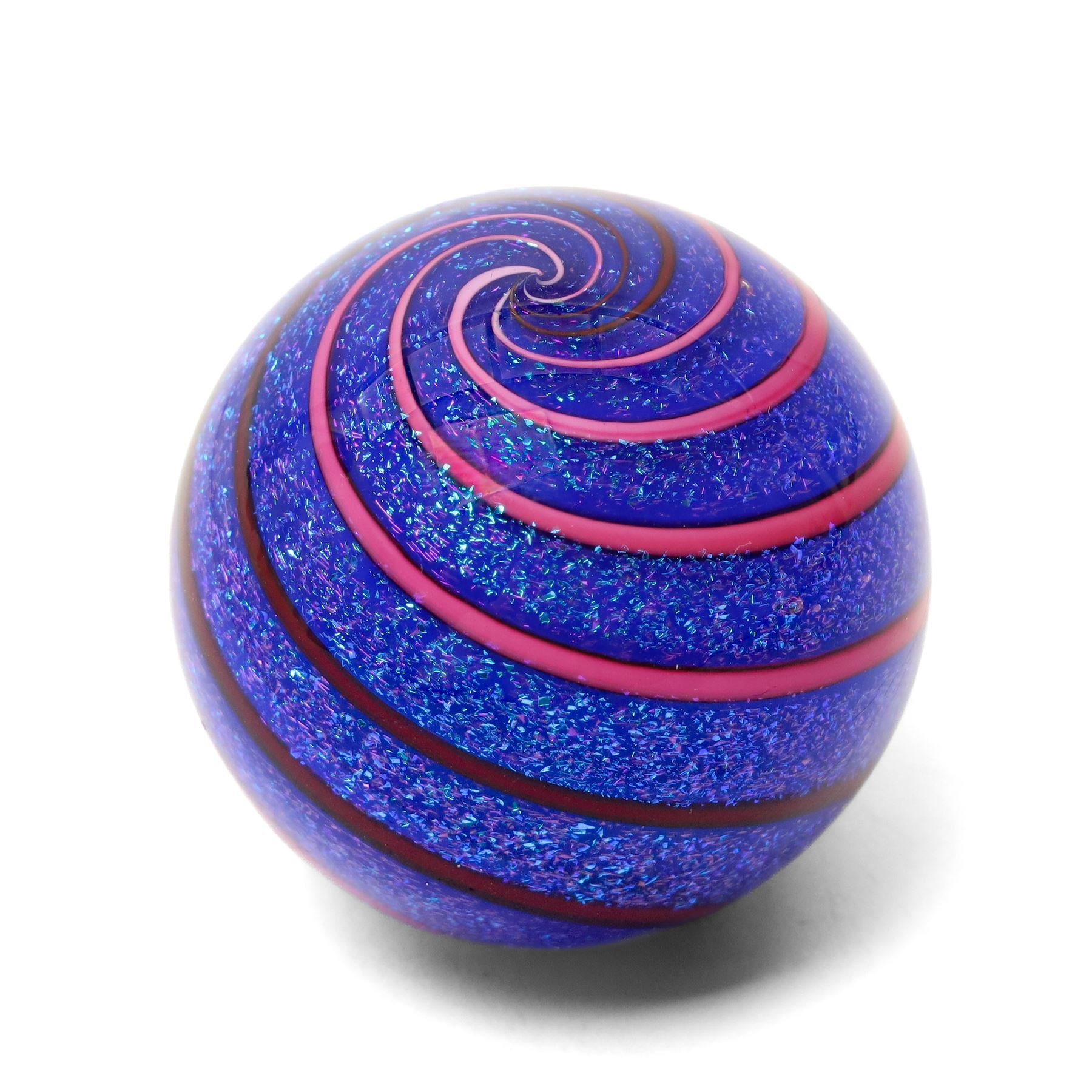 Geoffrey Beetem glass marble, pink and red spiral on a blue ground, signed to base, H5cm 