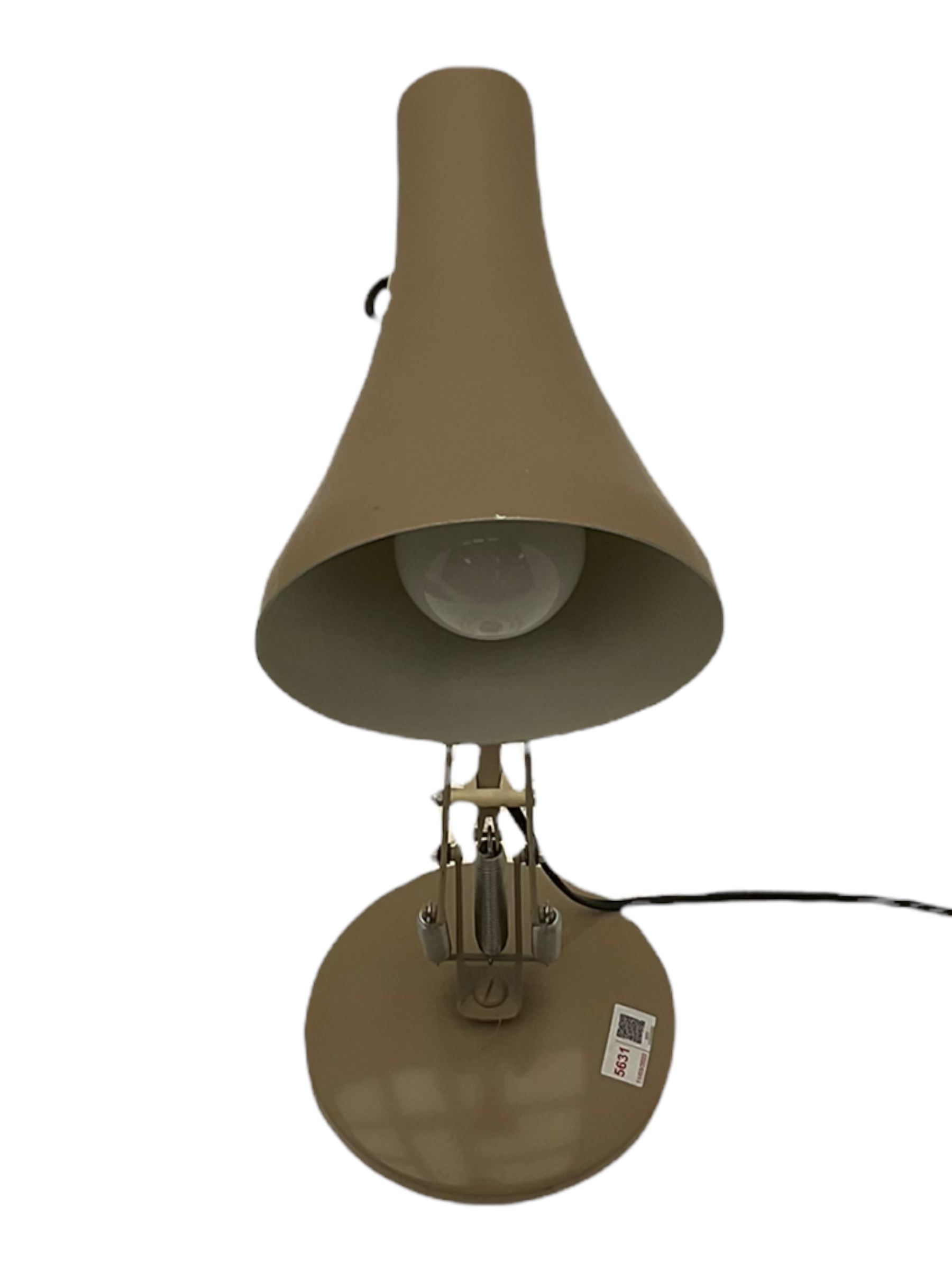 Angle-poise lamp and an Islamic prayer mat