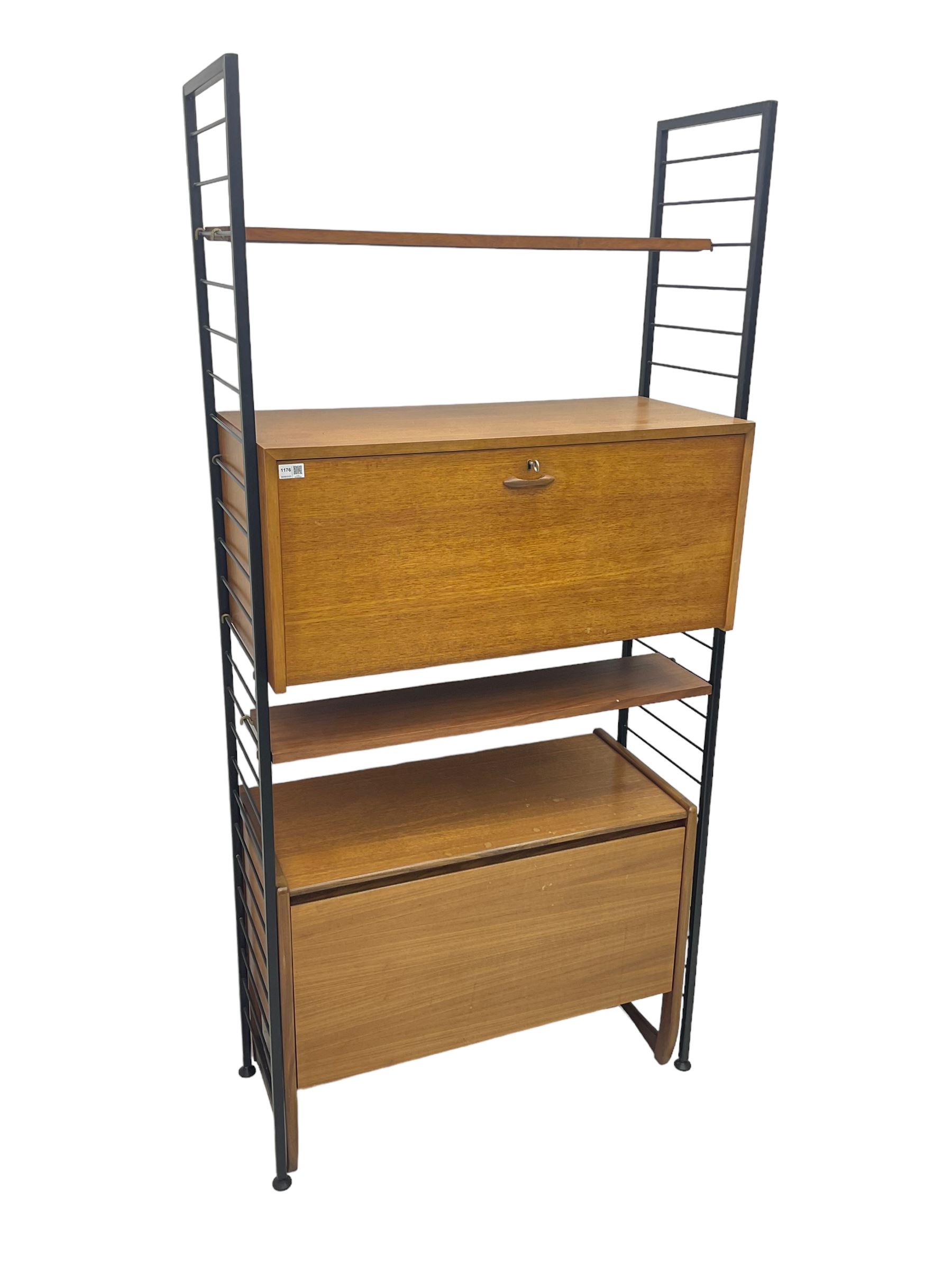 Staples Ladderax - mid-20th century teak and metal framed modular wall unit, fitted with central fall-front cupboard enclosing correspondence dividers, over secondary separate teak fall-front cupboard, adjustable shelf to top