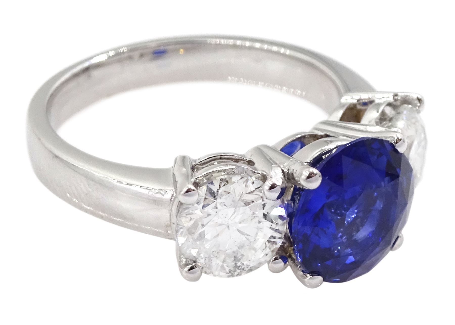 18ct white gold three stone sapphire and round brilliant cut diamond ring, hallmarked, sapphire approx 2.20 carat, total diamond weight approx 1.45 carat