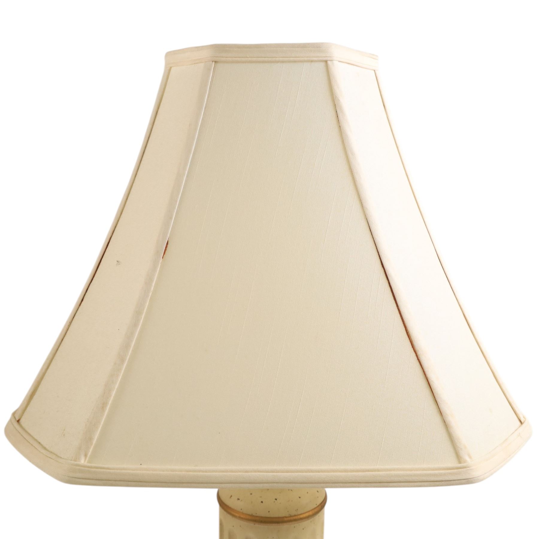Pair of table lamps, the central column with gilt and and black bands and a foliate boarder, with cream shades, H58cm without shades 