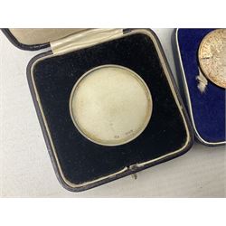 Commemorative coins and medallions, including hallmarked silver poultry medal, Royal Mint 'College of Arms Quincentenary Commemorative Medal', Selby Abbey '1069 1969' medallion, two medallions commemorating the Investiture of H.R.H. Prince Charles 1st July 1969 and a set of four coins commemorating the Investiture of Prince Charles, all cased 