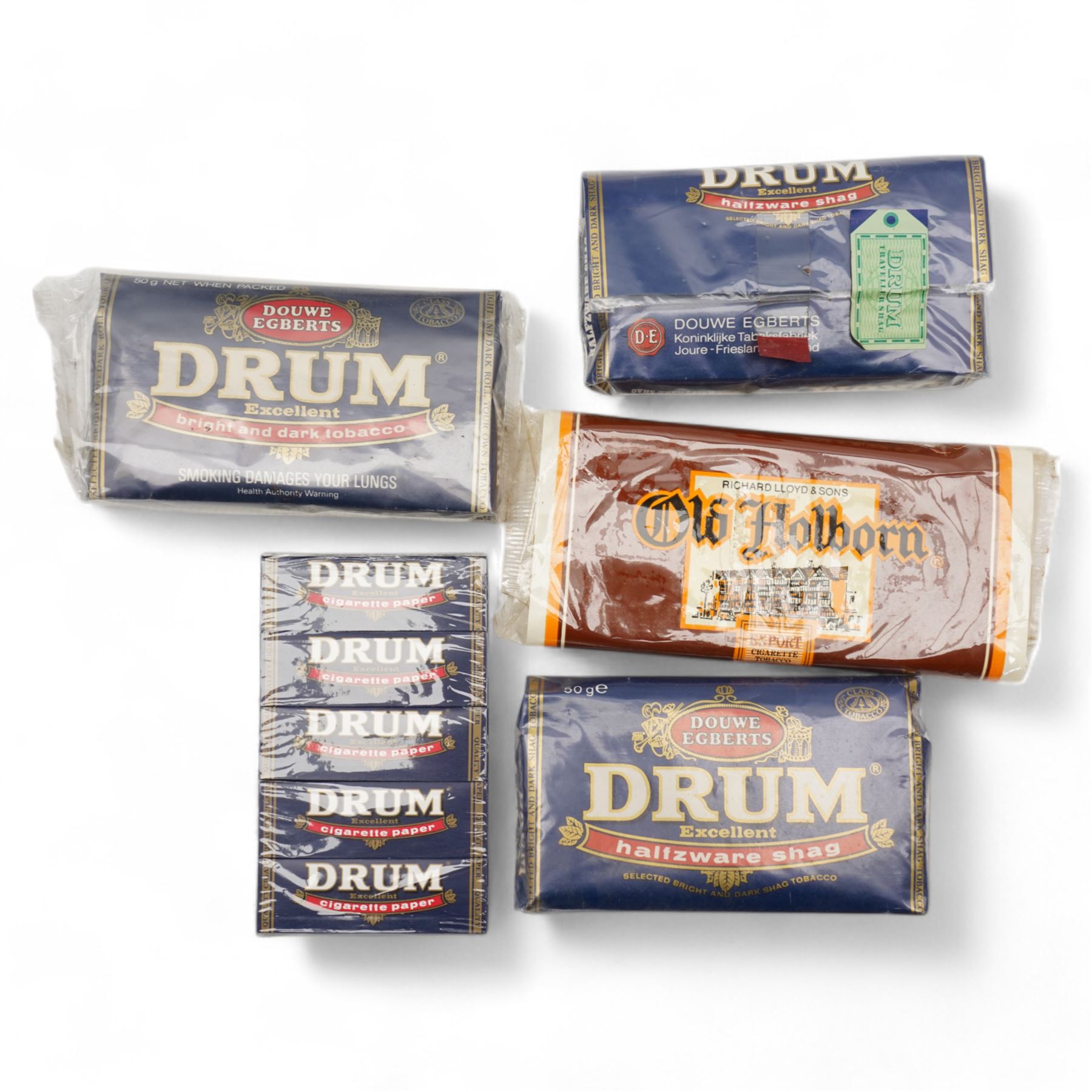 Unopened tin of Borkum Riff tobacco and other packets of tobacco and papers (6)