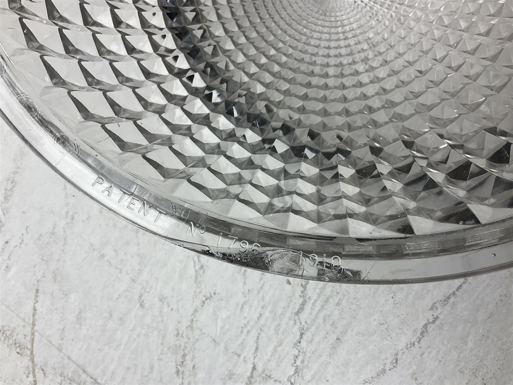 Edwardian glass holophane ceiling light, the domed bowl shade suspended in circular brass frame by three chains, stamped Crystal Bowl Holophane 8424, patent no 1796, 1910 on the inside rim, D35cm