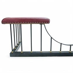 Wrought metal and brass fire fender, L-shaped corner seats upholstered in burgundy fabric with stud bands, dished centre on balustrade and plain curb  