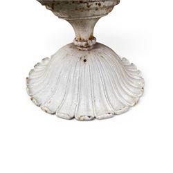 Coalbrookdale - pair of 19th century cast iron petal rim urns, squat form on square plinth, finished in distressed white paint, design registration number 133334, first registered 19 september 1860, number 19 in the Coalbrookdale Castings Catalogue (see illustration)