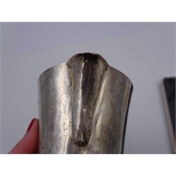 Modern Arts and Crafts style silver jug, of tapering form with capped C handle and hammered finish throughout, upon circular foot, hallmarked John Henry Pank, London 1977, with Hull town mark, H11cm