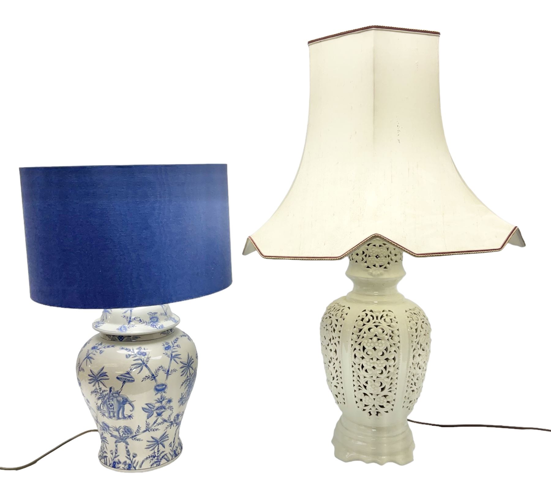 Modern pierced oriental white ceramic vase shaped table lamp, together with a blue and white baluster shaped example decorated with figures upon elephants, both with shades, tallest H83cm incl shade