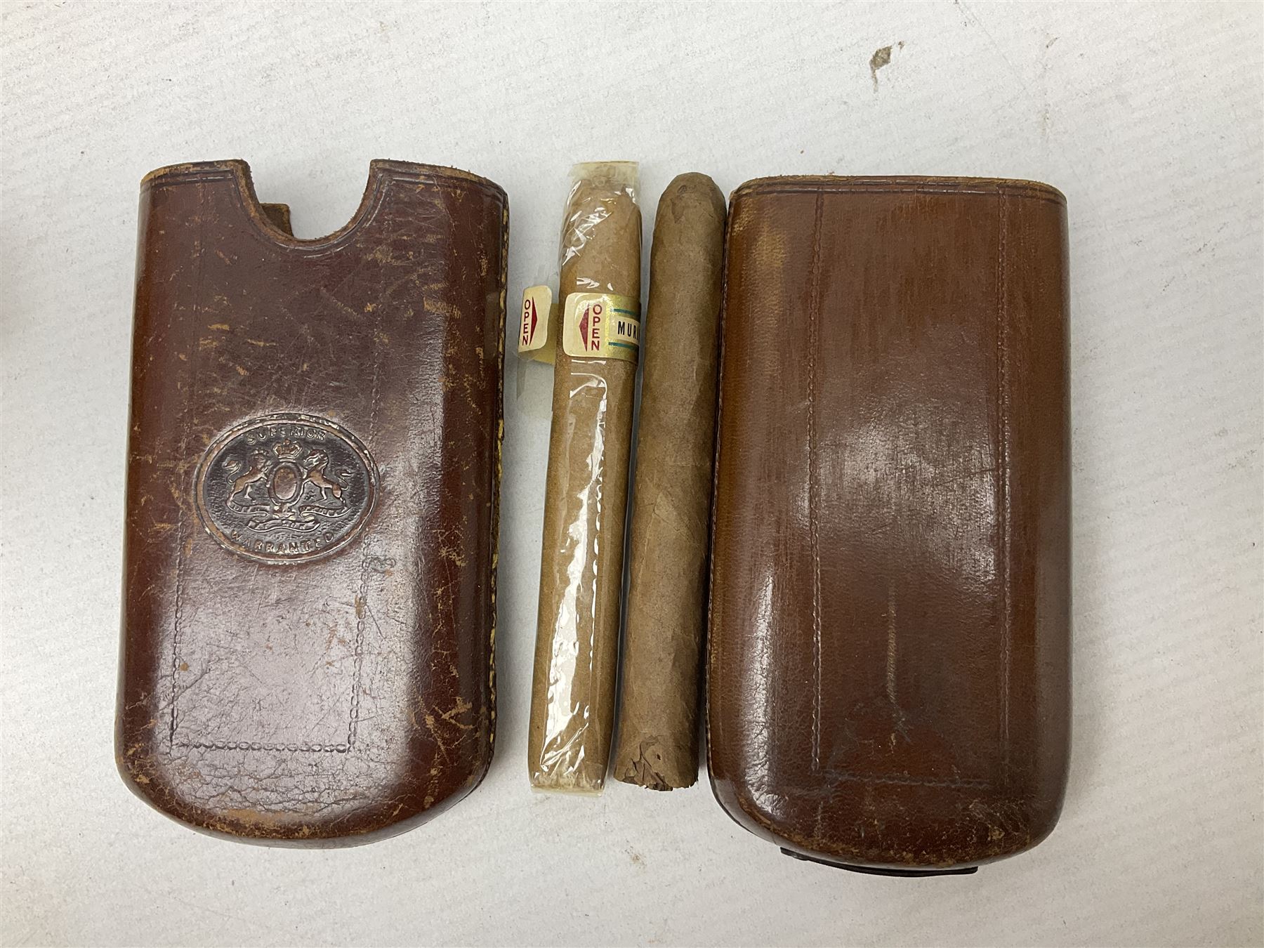 Victorian leather cigar protector with metal match striking plate on the end, and quantity of boxed cigars, comprising Willem II Churchill cigar, Willem II double dutch, Quintero Y Hno Habana cigars and Romeo Y Julieta, habana