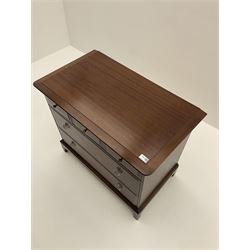 Stag multi-drawer mahogany chest, fitted with three short drawers and two long drawers, raised on shaped supports 