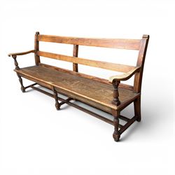 Early 20th century pine and oak bench seat, stained pine rail back frame with shaped oak arms