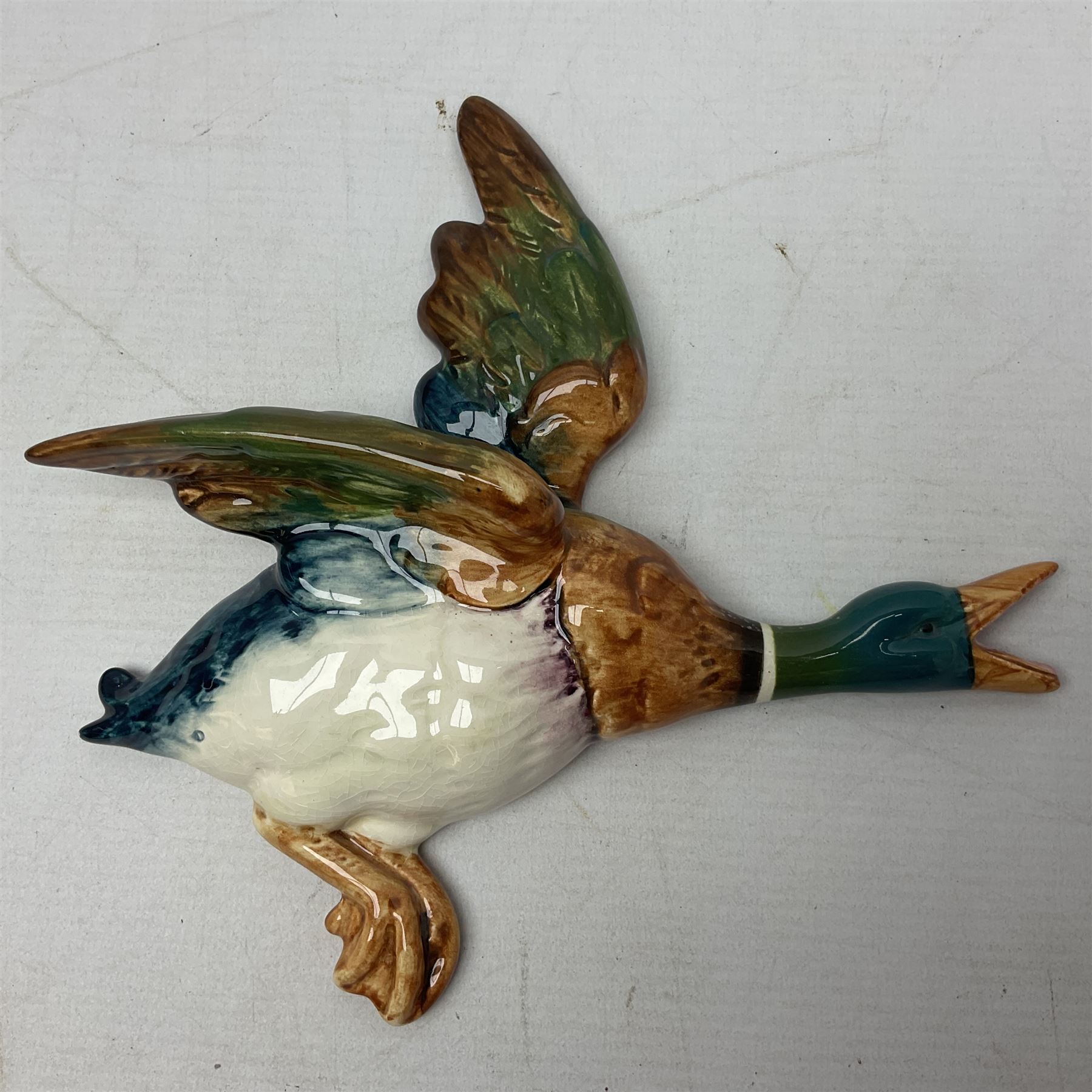 Set of five Beswick graduated wall mounting figures of flying ducks, models from 596/0 to 596/4, largest L29cm