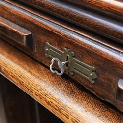 Globe Wernicke - Oak roll top desk, tambour roll top enclosing a fitted interior, raised on two pedestal bases with fitted drawers, raised on a plinth base 