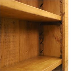 Indigo Furniture - large rustic oak open bookcase, with four adjustable shelves, above a plinth base 