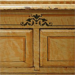 19th century pine painted chest of drawers, rectangular moulded top above two short and three graduated long drawers, each with painted foliate scroll and line detailing, turned knobs, and concealed turned feet, the sides with rounded corners and ebonised detail