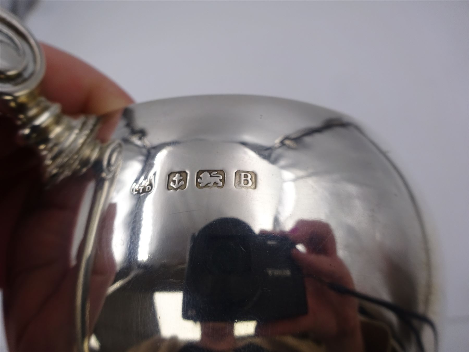 1920s silver trophy cup, of typical form, with twin C scroll handles, upon stepped circular base, hallmarked Birmingham 1926, maker's mark worn and indistinct, H14cm