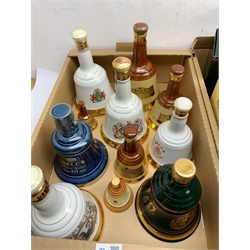 A collection of various Bell's Whisky decanters, to include three Royal Commemorative examples, a number in boxes/tins. 